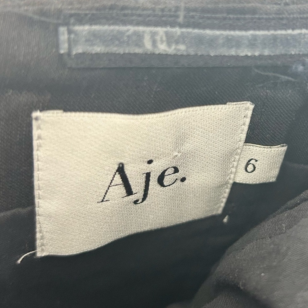 Aje The Hybrid Ruffle Sleeveless Mini Dress in Black - Picture 8 of 10